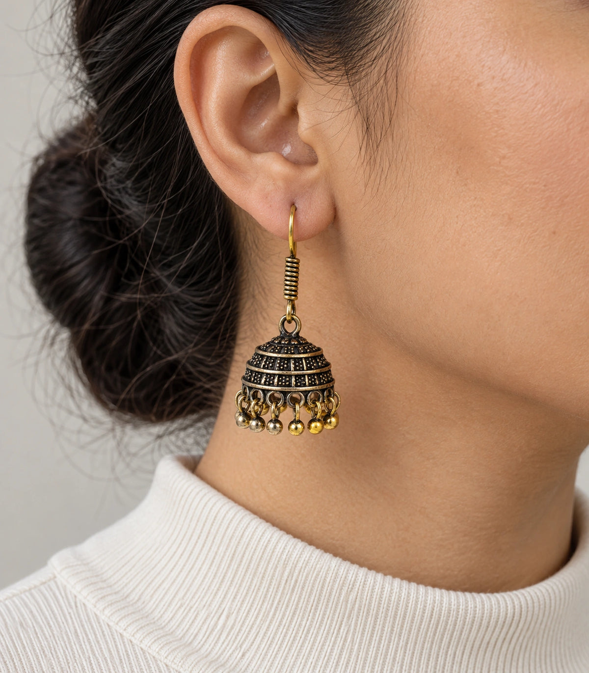 JIMIKI Antique Gold Banded Dotted Hook Jhumka Earrings in Antique Gold - worn styling view #color_antique-gold