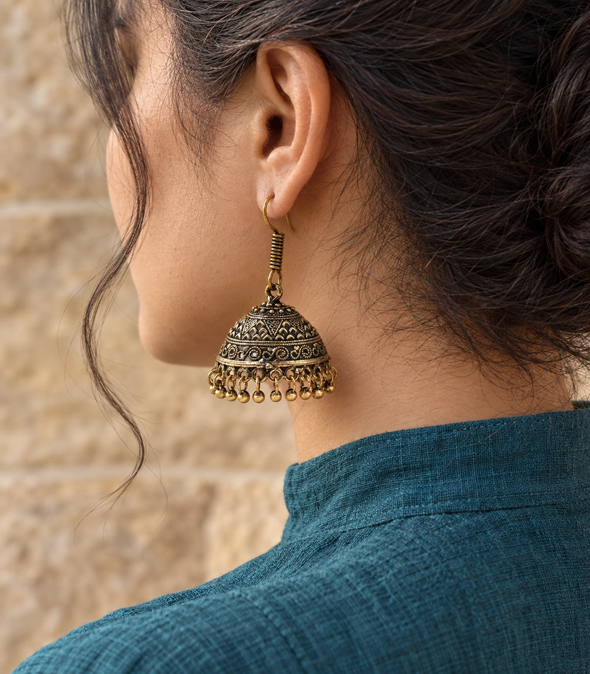 JIMIKI Antique Gold Chevron Scroll Jhumka Earrings - Antique Gold styled model wearing the earring #color_antique-gold