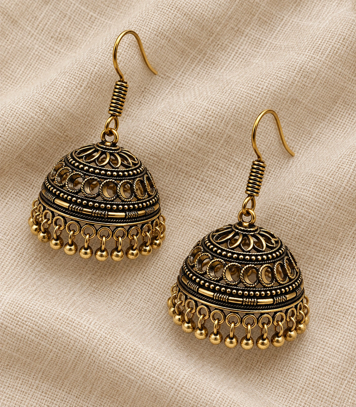 JIMIKI Antique Gold Crescent Openwork Hook Jhumka Earrings in Antique Gold - editorial flatlay #color_antique-gold