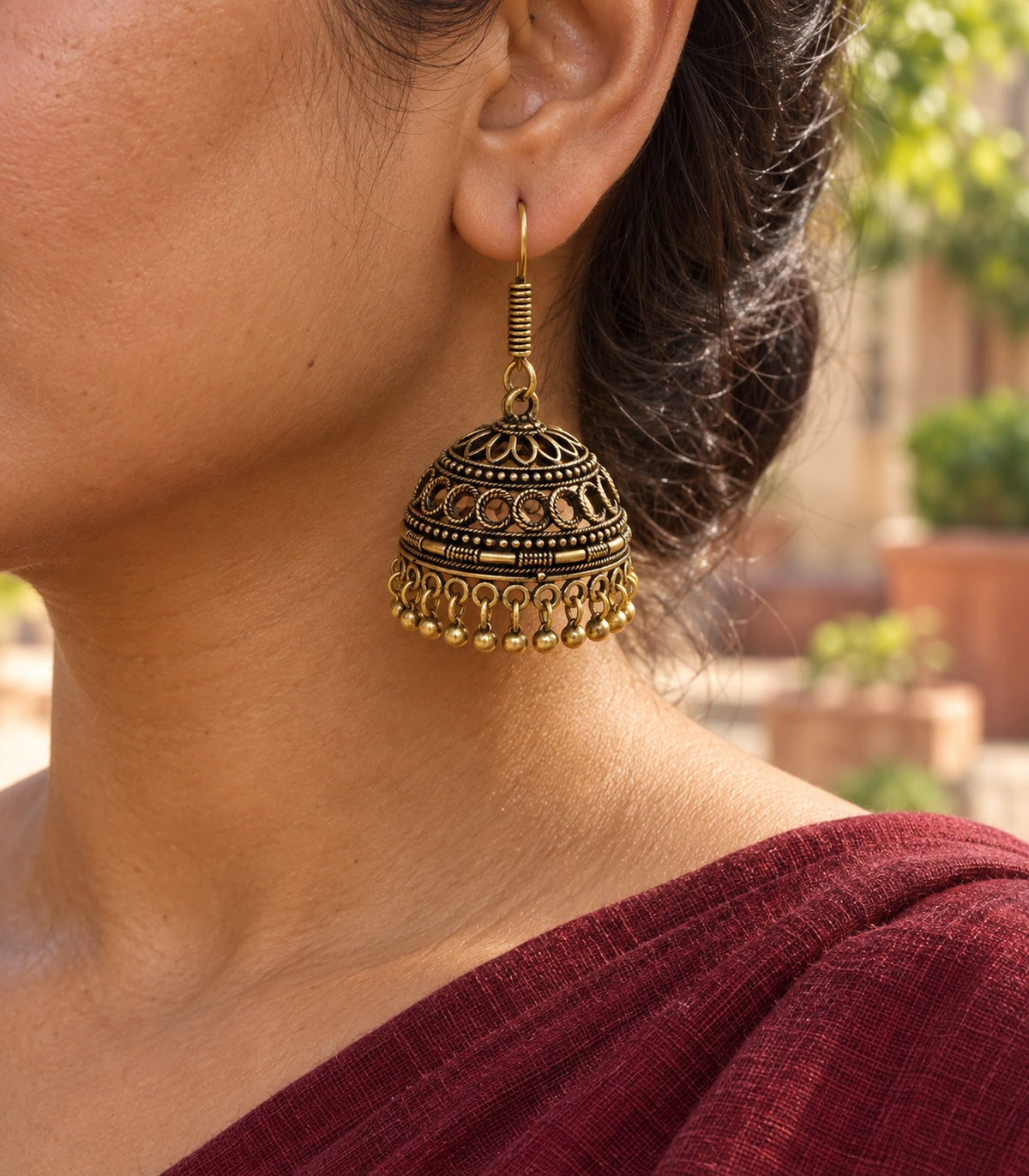 JIMIKI Antique Gold Crescent Openwork Hook Jhumka Earrings in Antique Gold - editorial worn view #color_antique-gold