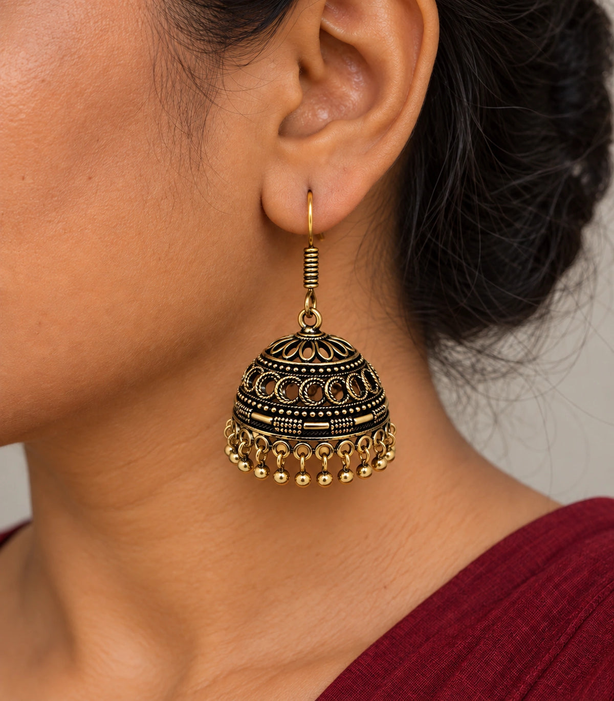 JIMIKI Antique Gold Crescent Openwork Hook Jhumka Earrings in Antique Gold - worn styling view #color_antique-gold