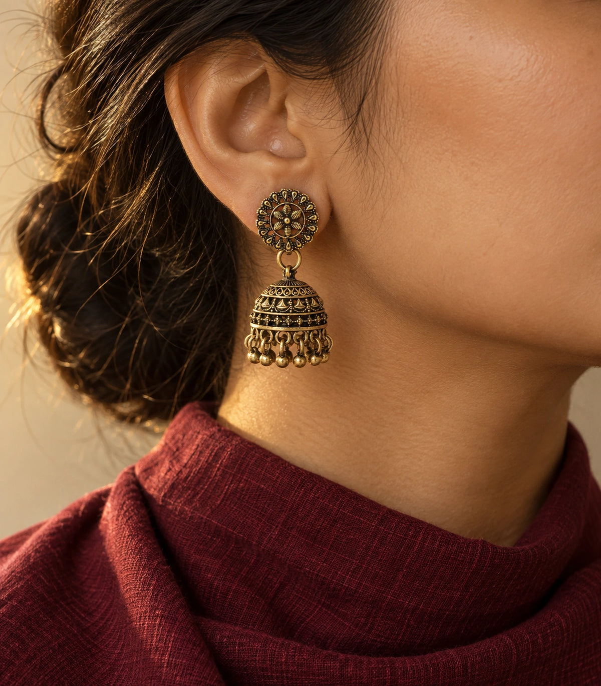 JIMIKI Antique Gold Floral Fan Dome Jhumka Earrings - styled model wearing the earring #color_antique-gold