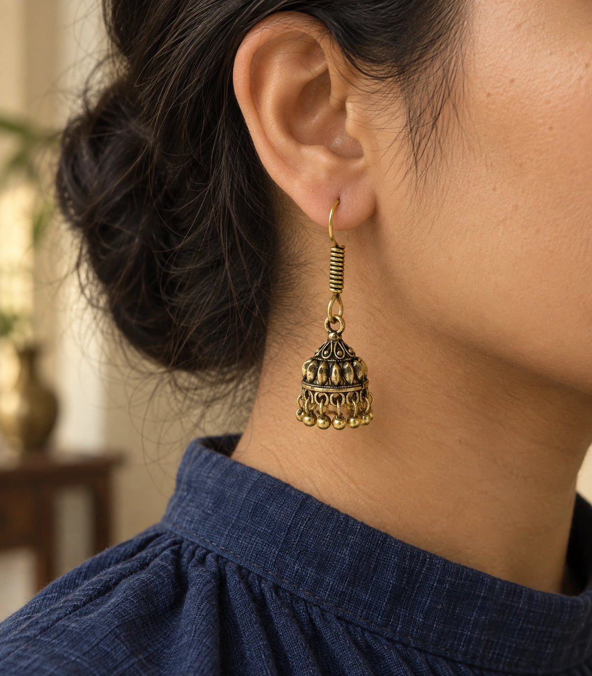 JIMIKI Leaf Dome Hook Jhumka Earrings in Antique Gold - editorial worn view #color_antique-gold