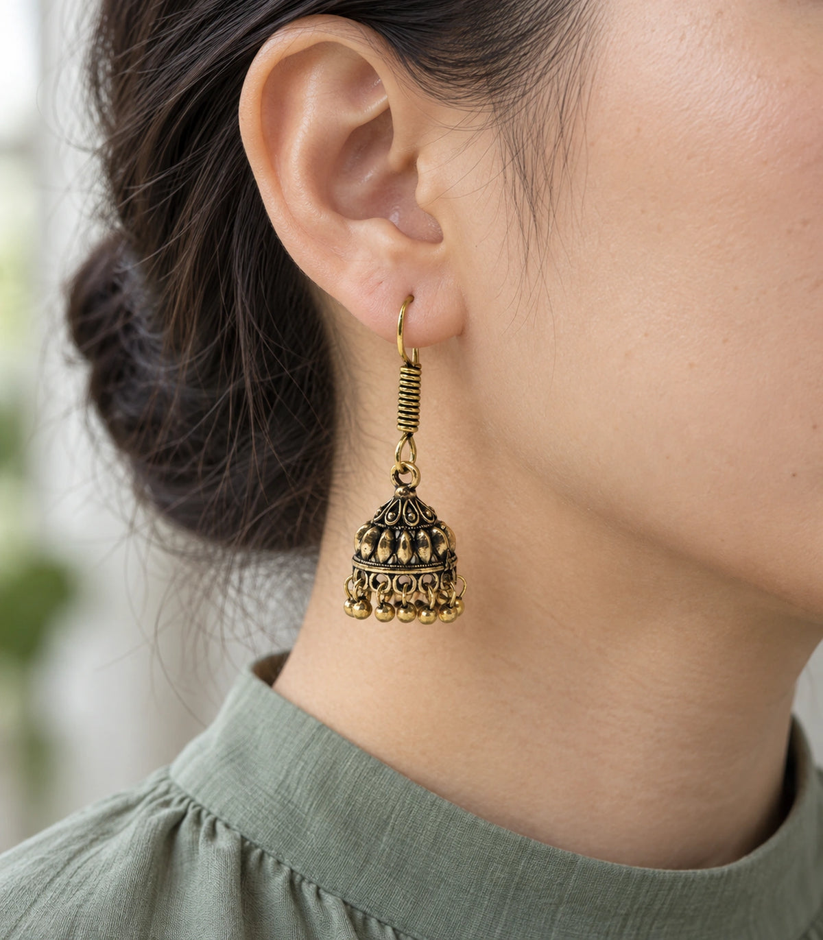 JIMIKI Leaf Dome Hook Jhumka Earrings in Antique Gold - worn styling view #color_antique-gold