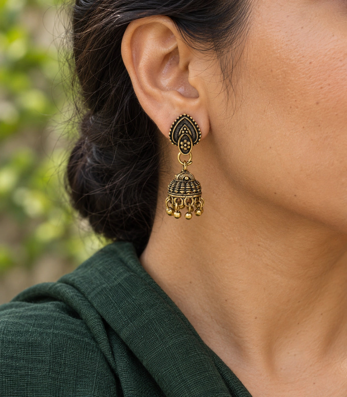 JIMIKI Leaf Stud Beaded Jhumka Earrings - Antique Gold earring worn with a clear view of the design #color_antique-gold