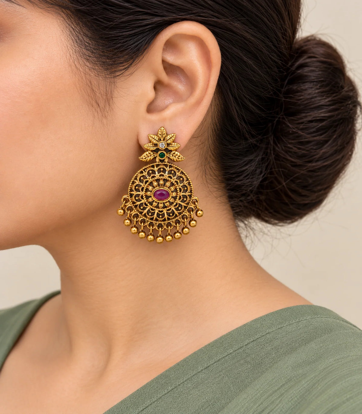Close-up of JIMIKI leafy tops, green accents and magenta disc earrings worn naturally #color_antique-gold-magenta-green