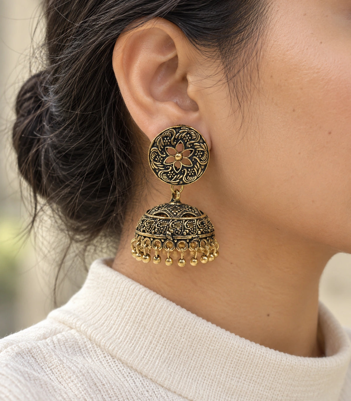 JIMIKI Antique Gold Open Flower Paisley Jhumka Earrings in Antique Gold - worn styling view #color_antique-gold