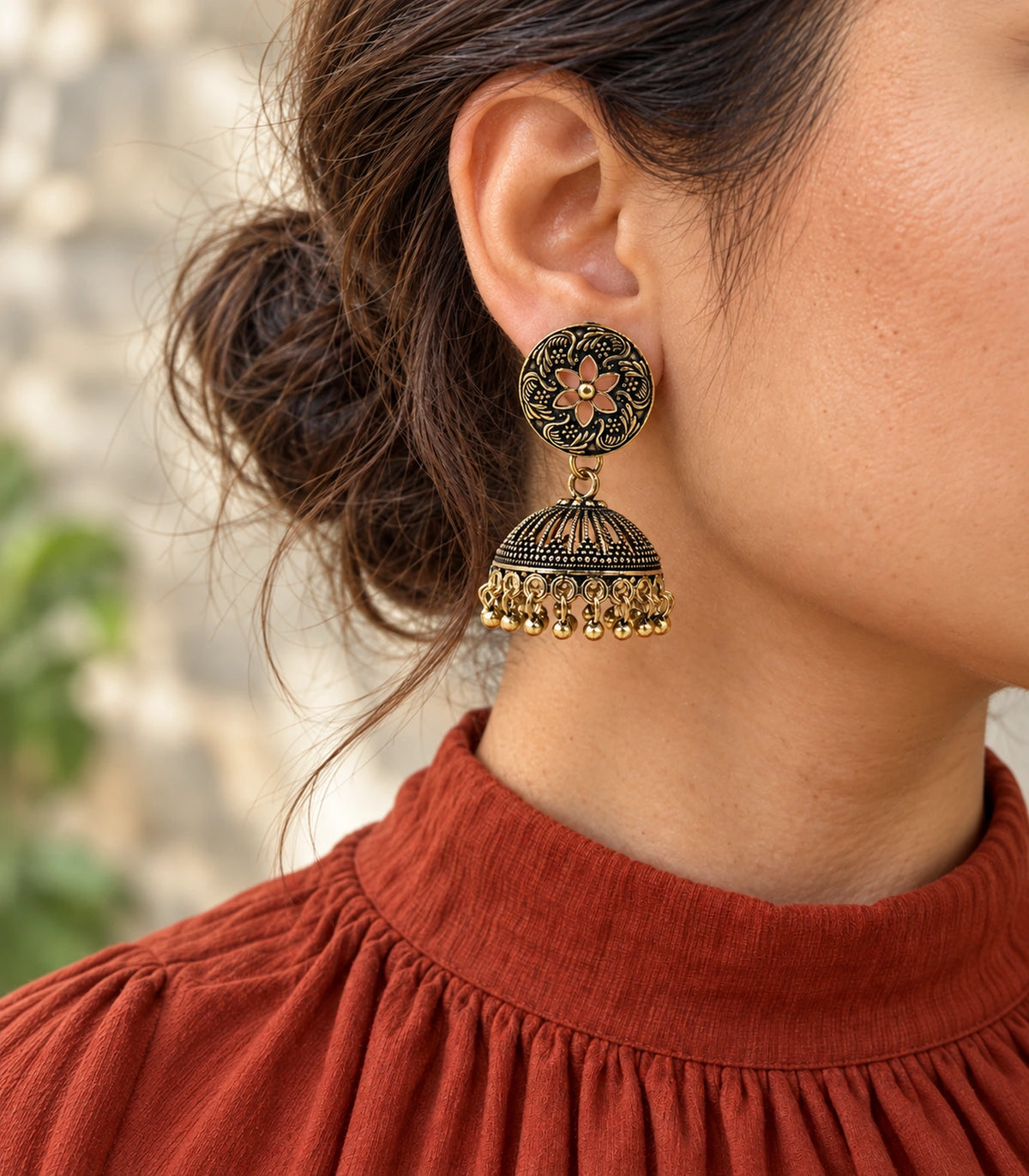 JIMIKI Antique Gold Open Flower Ribbed Jhumka Earrings in Antique Gold - editorial worn view #color_antique-gold