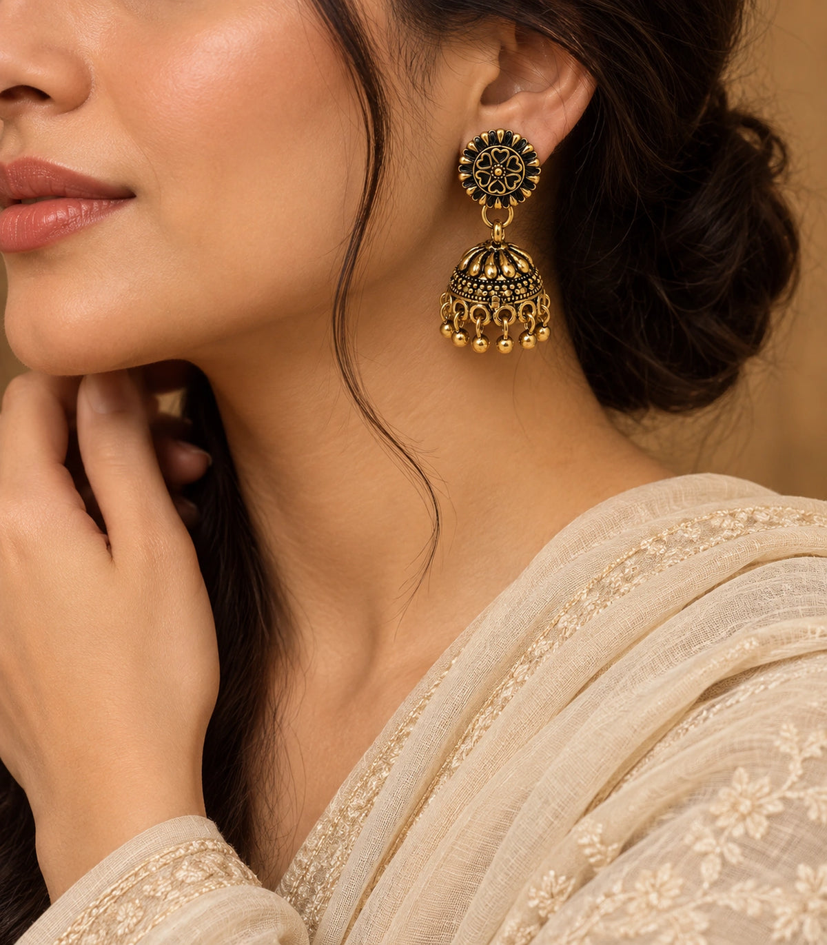 JIMIKI Antique Gold Petal Dome Jhumka Earrings - editorial styling with cream clothing #color_antique-gold