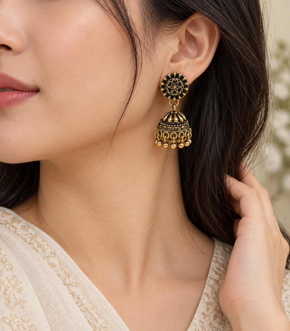 JIMIKI Antique Gold Petal Dome Jhumka Earrings - earrings worn with a cream outfit #color_antique-gold