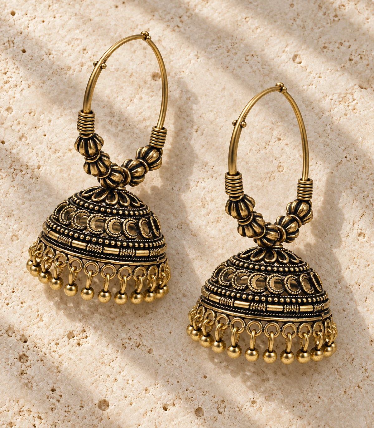 JIMIKI Antique Gold Ribbed Bead Hoop Crescent Jhumka Earrings in Antique Gold - editorial flatlay #color_antique-gold