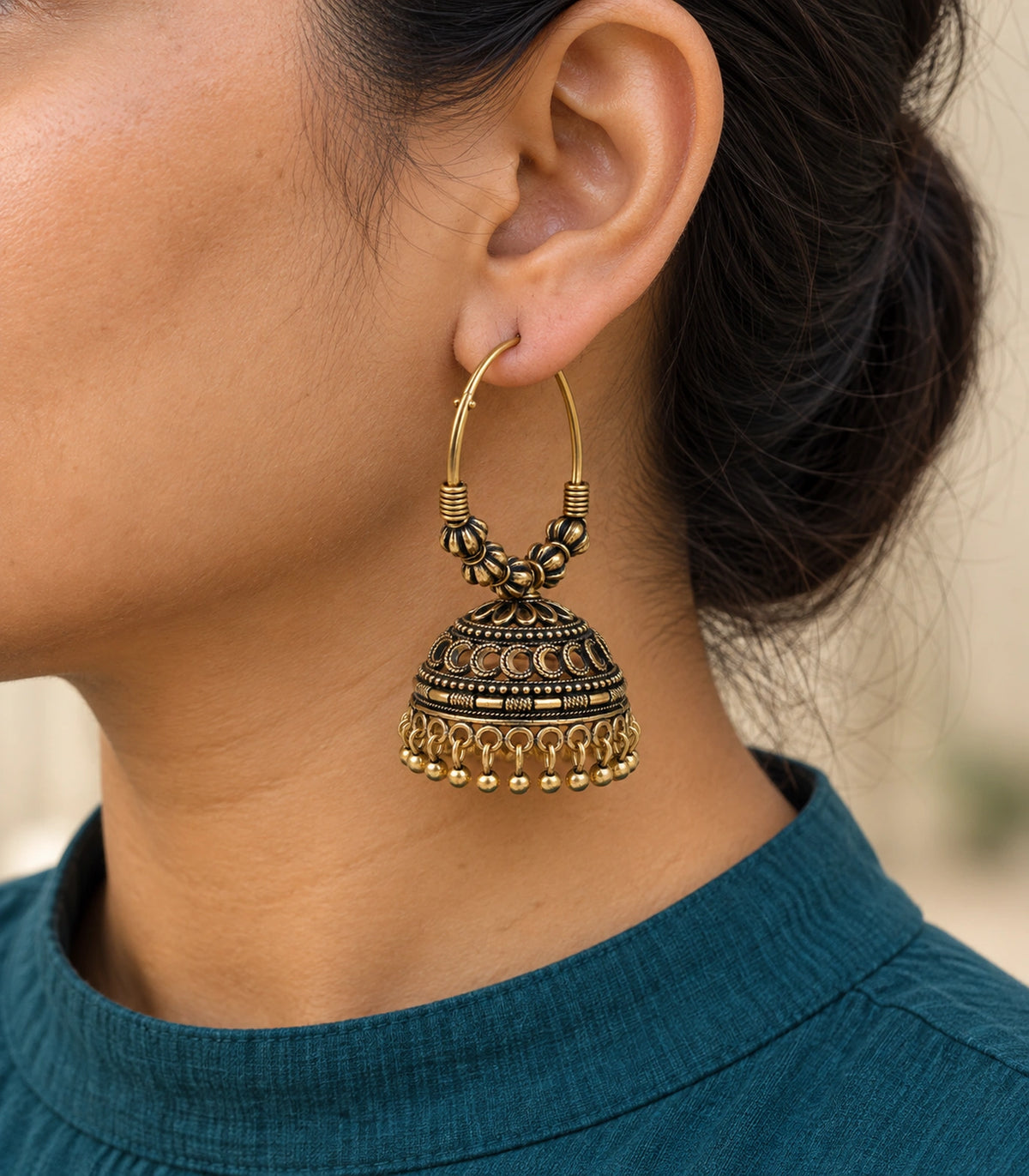 JIMIKI Antique Gold Ribbed Bead Hoop Crescent Jhumka Earrings in Antique Gold - worn styling view #color_antique-gold
