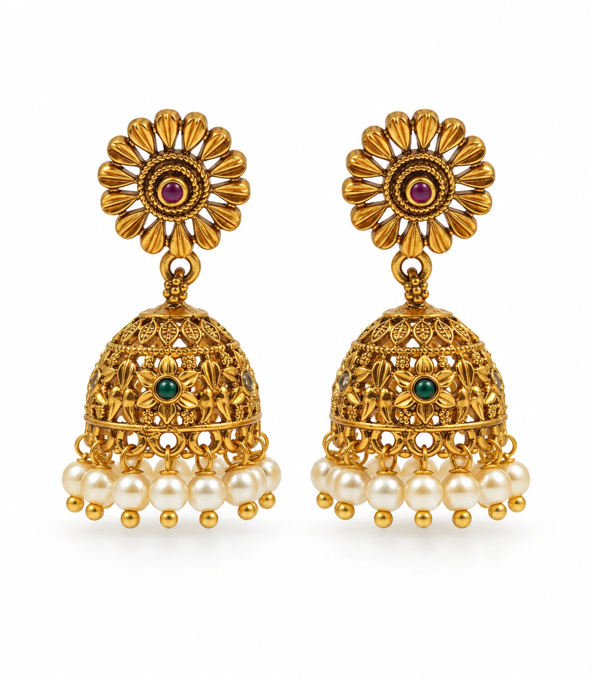 Pair of antique gold tone sunflower jhumka earrings with magenta stud centres, green floral bells and cream pearl fringe on white