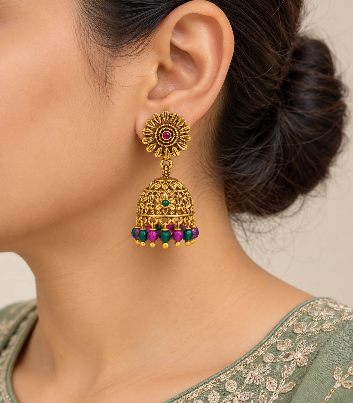 Antique gold-tone sunflower multicolour bead jhumka earrings, closeup view