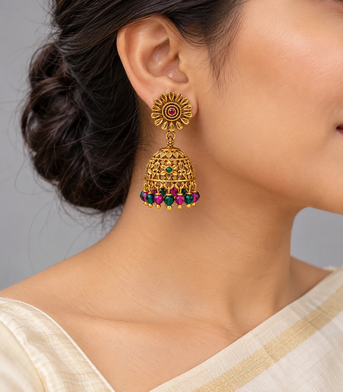 Antique gold-tone sunflower multicolour bead jhumka earrings, model view