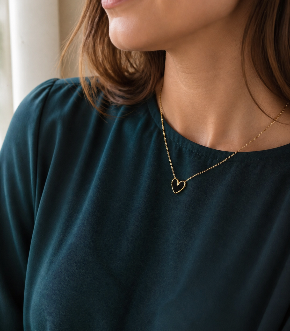 Black Heart Pendant Necklace styled on a model