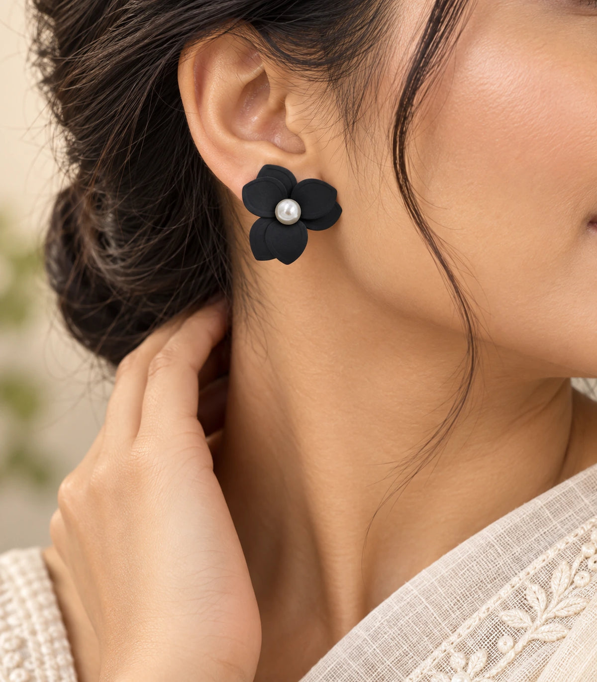 JIMIKI Black Triple Petal Pearl Flower Stud Earrings - earring worn in editorial styling #color_black
