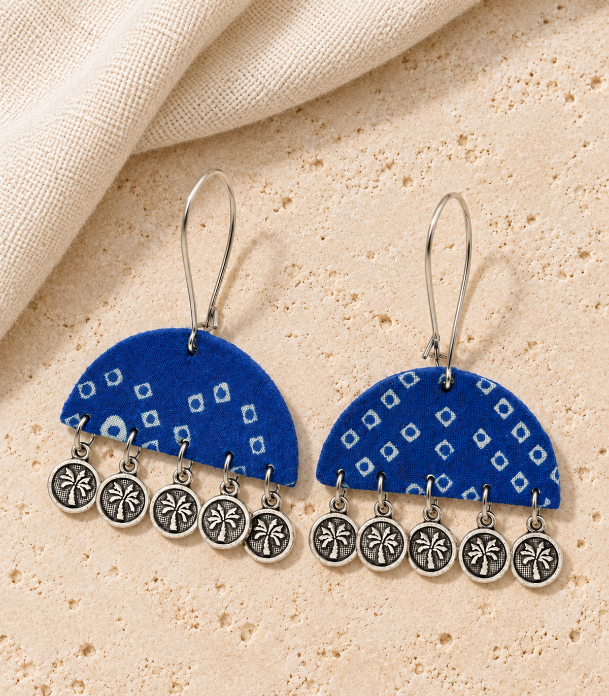 Blue Geometric Fabric Coin Earrings – editorial flatlay view