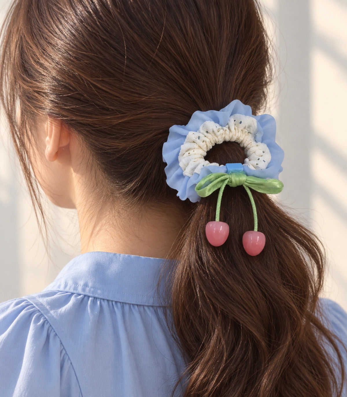 JIMIKI Lace Scrunchie With Cherry Charms in Blue, editorial model view #color_blue
