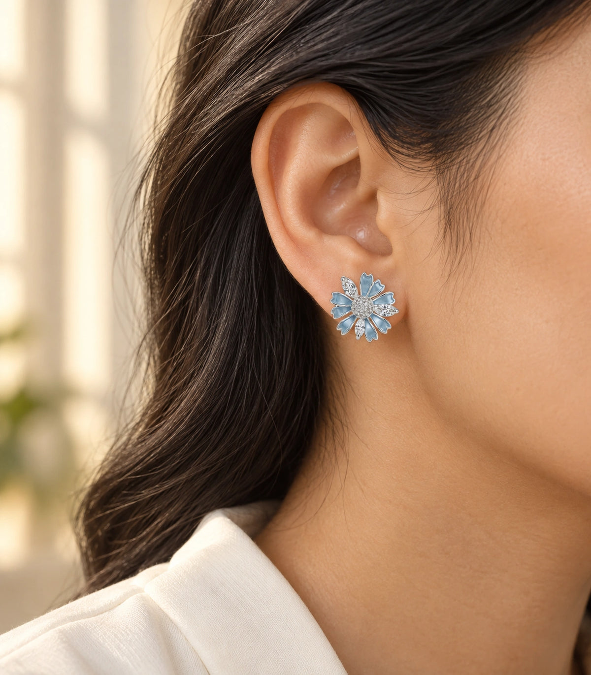 JIMIKI Petal Crystal Flower Stud Earring Pair in Blue / silver tone, editorial model view #color_blue / silver tone