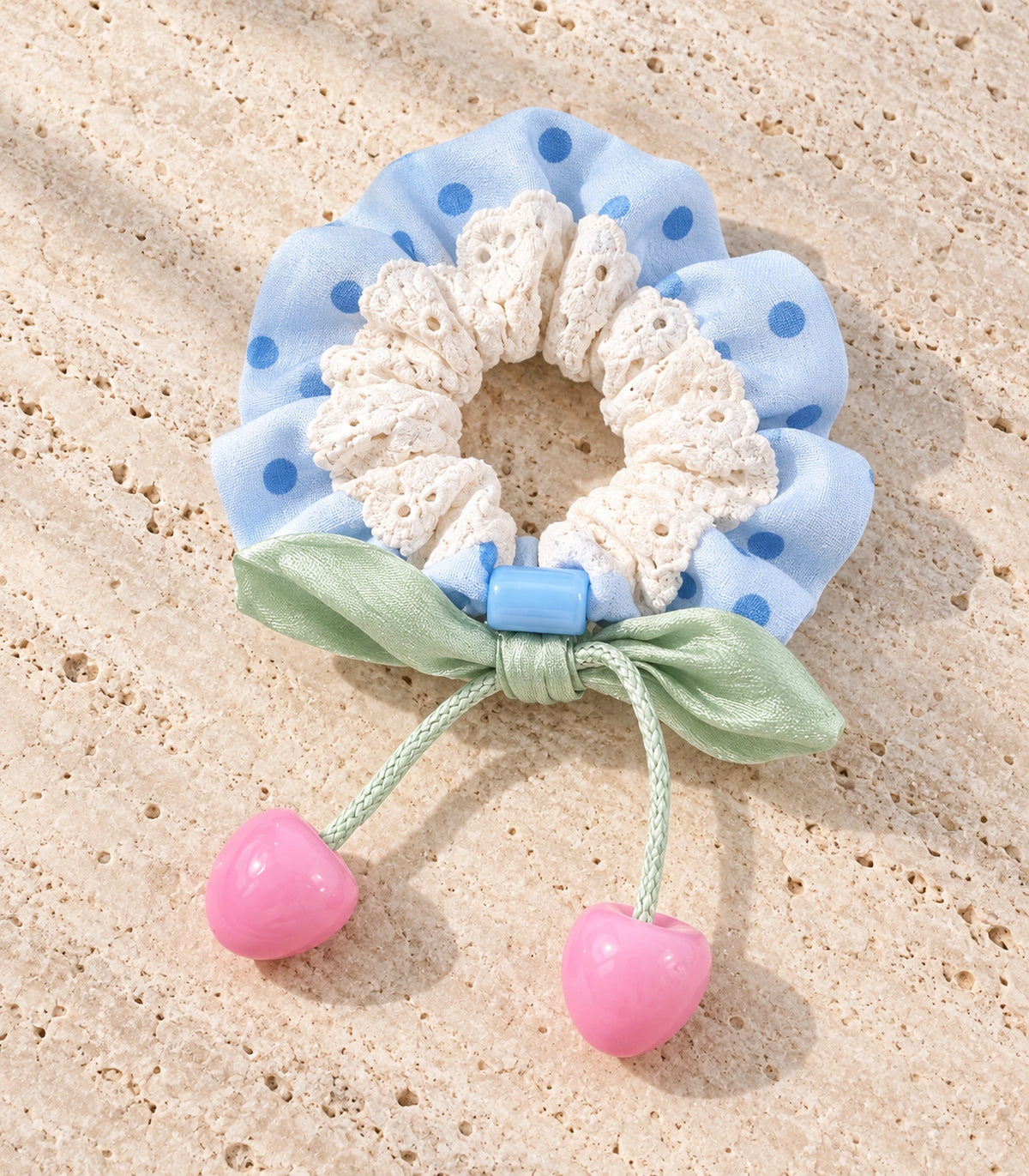 JIMIKI Polka Dot Lace Scrunchie With Cherry Charms in Blue, editorial flat lay #color_blue