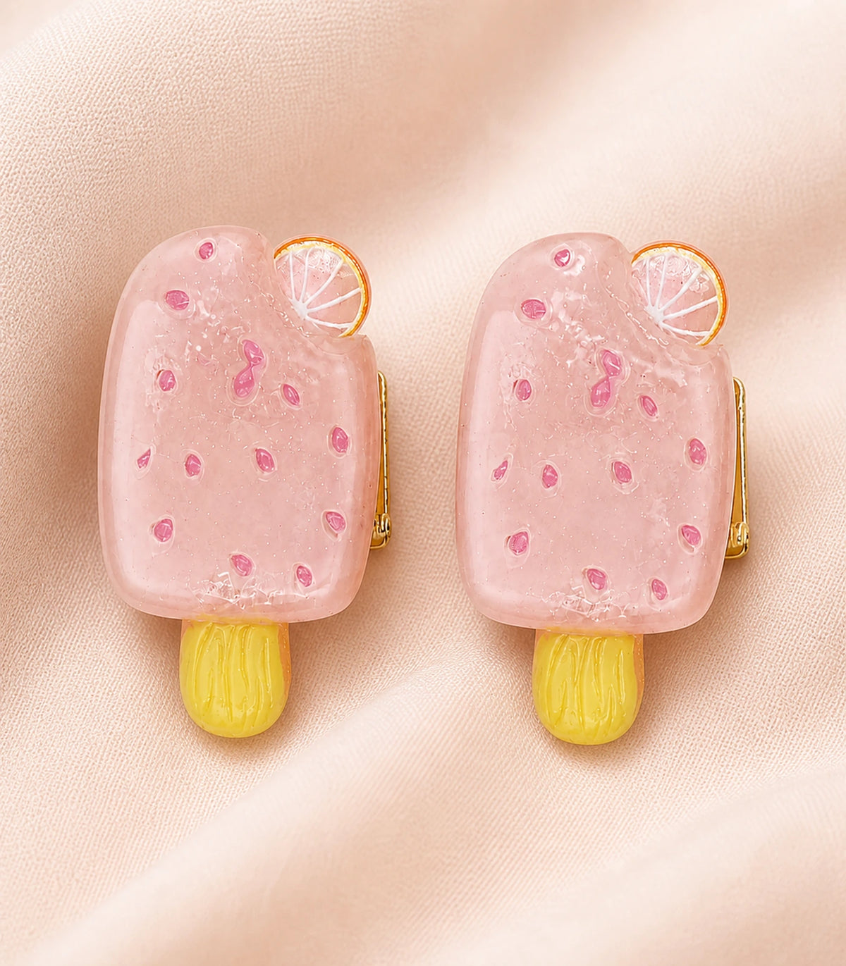 Close-up of the Blush Pink Citrus Popsicle Clip Pair details