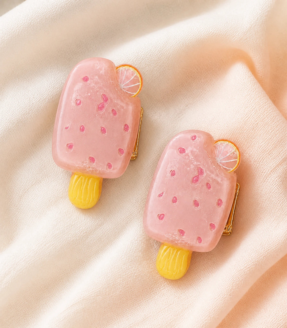 Editorial flat lay of the Blush Pink Citrus Popsicle Clip Pair