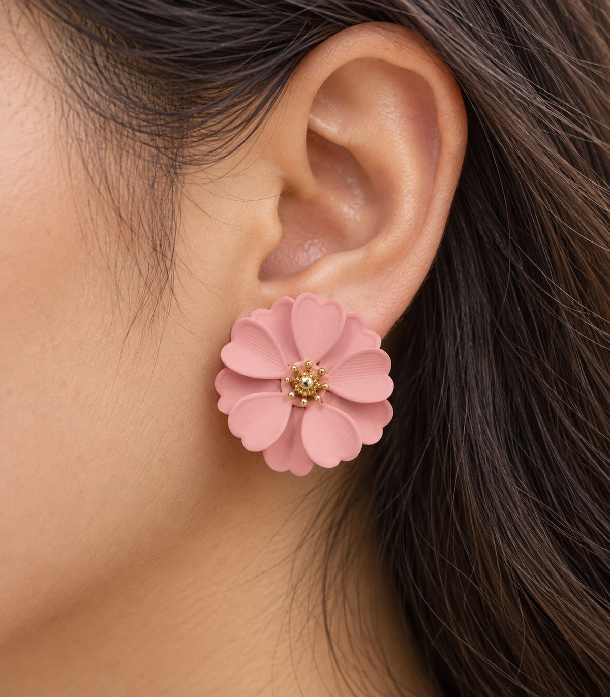 JIMIKI Blush Pink Layered Daisy Stud Earrings - layered scalloped petals and gold-tone centre worn close-up #color_blush pink