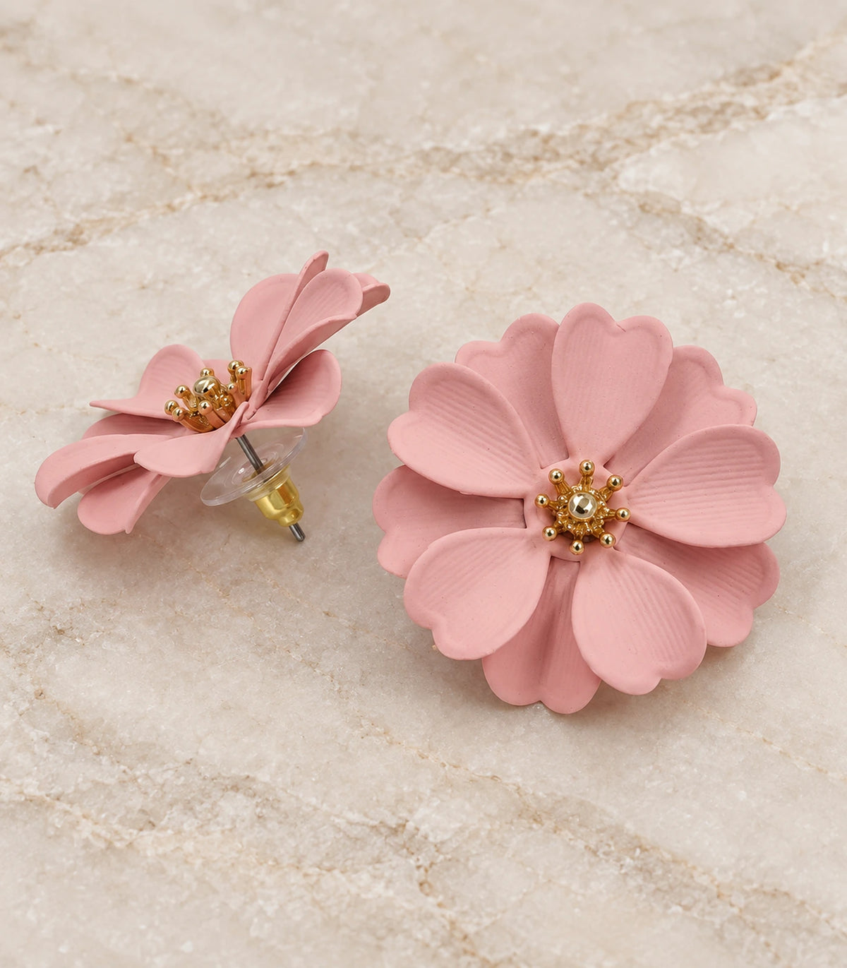 JIMIKI Blush Pink Layered Daisy Stud Earrings - pair in styled flatlay #color_blush pink