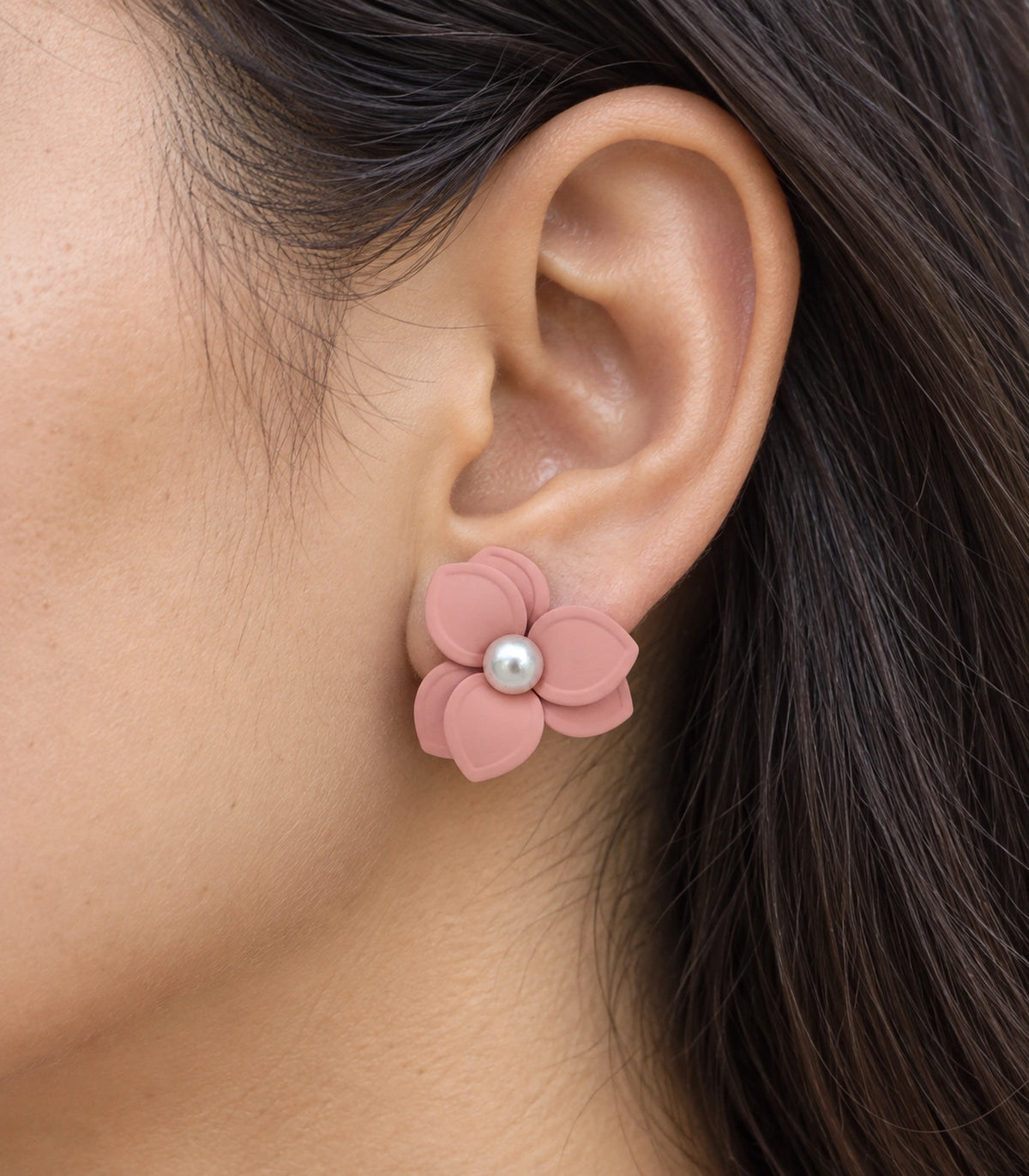JIMIKI Blush Pink Triple Petal Pearl Flower Stud Earrings - layered petals and pearl-style centre worn close-up #color_blush pink
