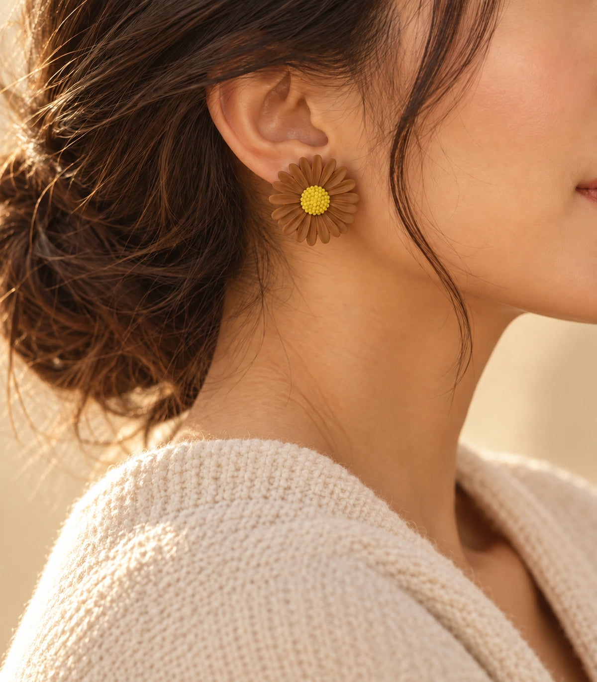 JIMIKI Camel yellow centre daisy stud earrings, earring worn in a warm editorial setting #color_camel