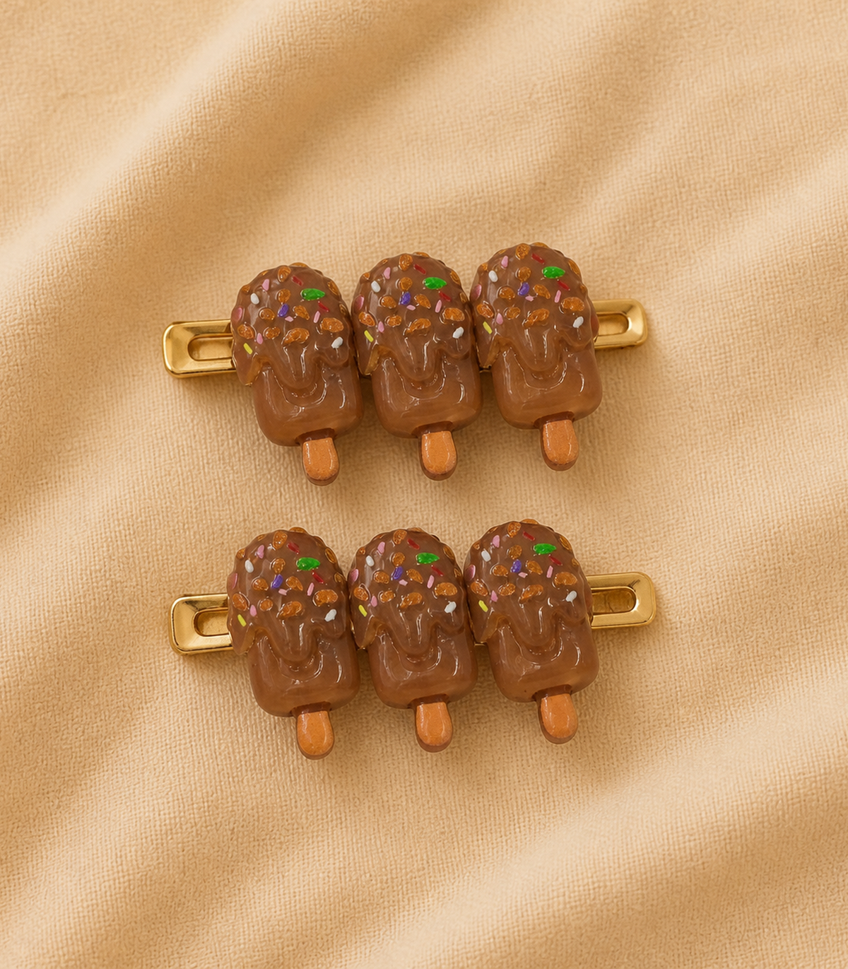 Chocolate Iced Pop Trio Clip Pair in an editorial flat lay