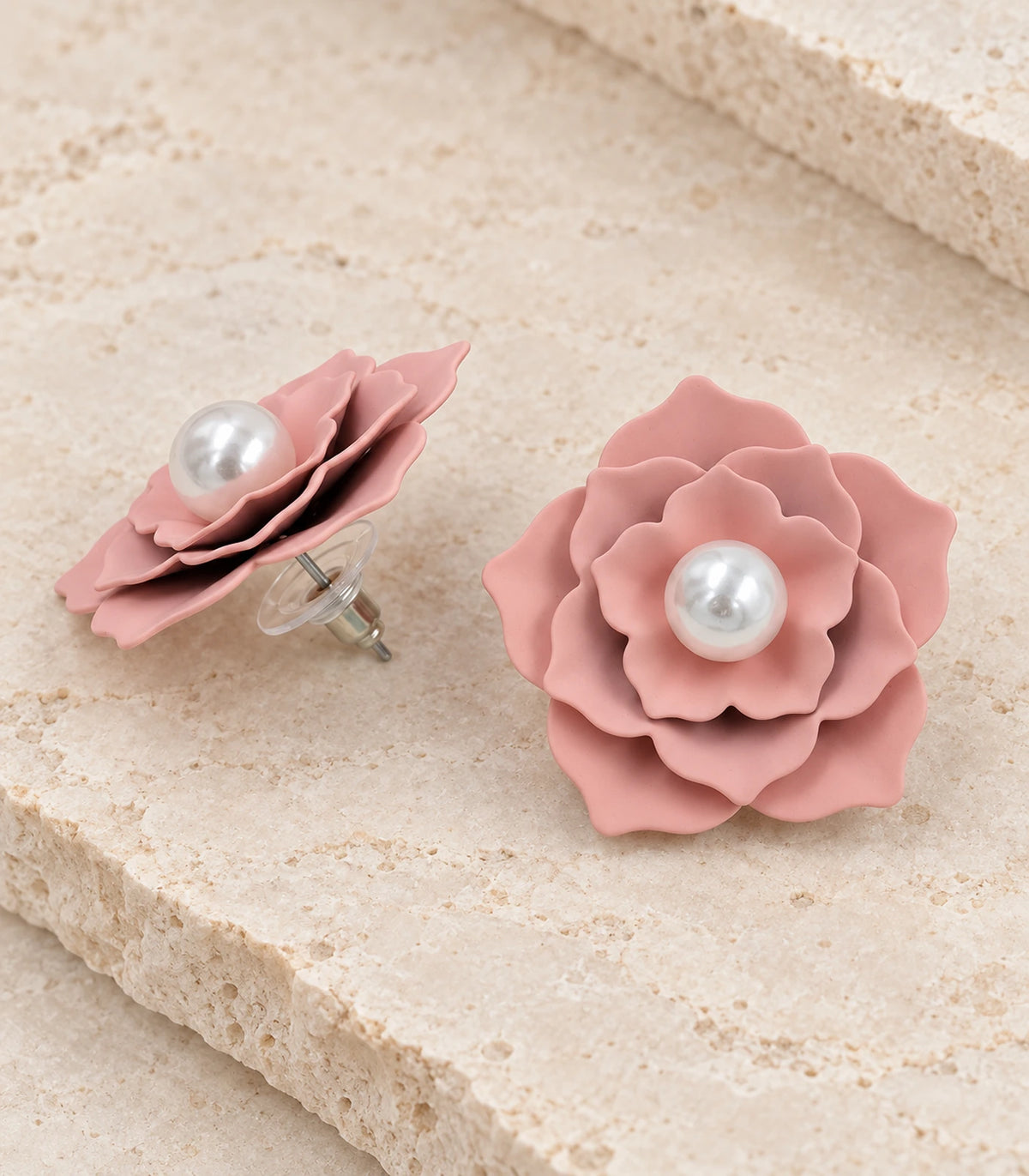 JIMIKI Layered Flower Pearl Stud Earrings, Dusty Pink — pair in a styled flat lay #color_dusty pink