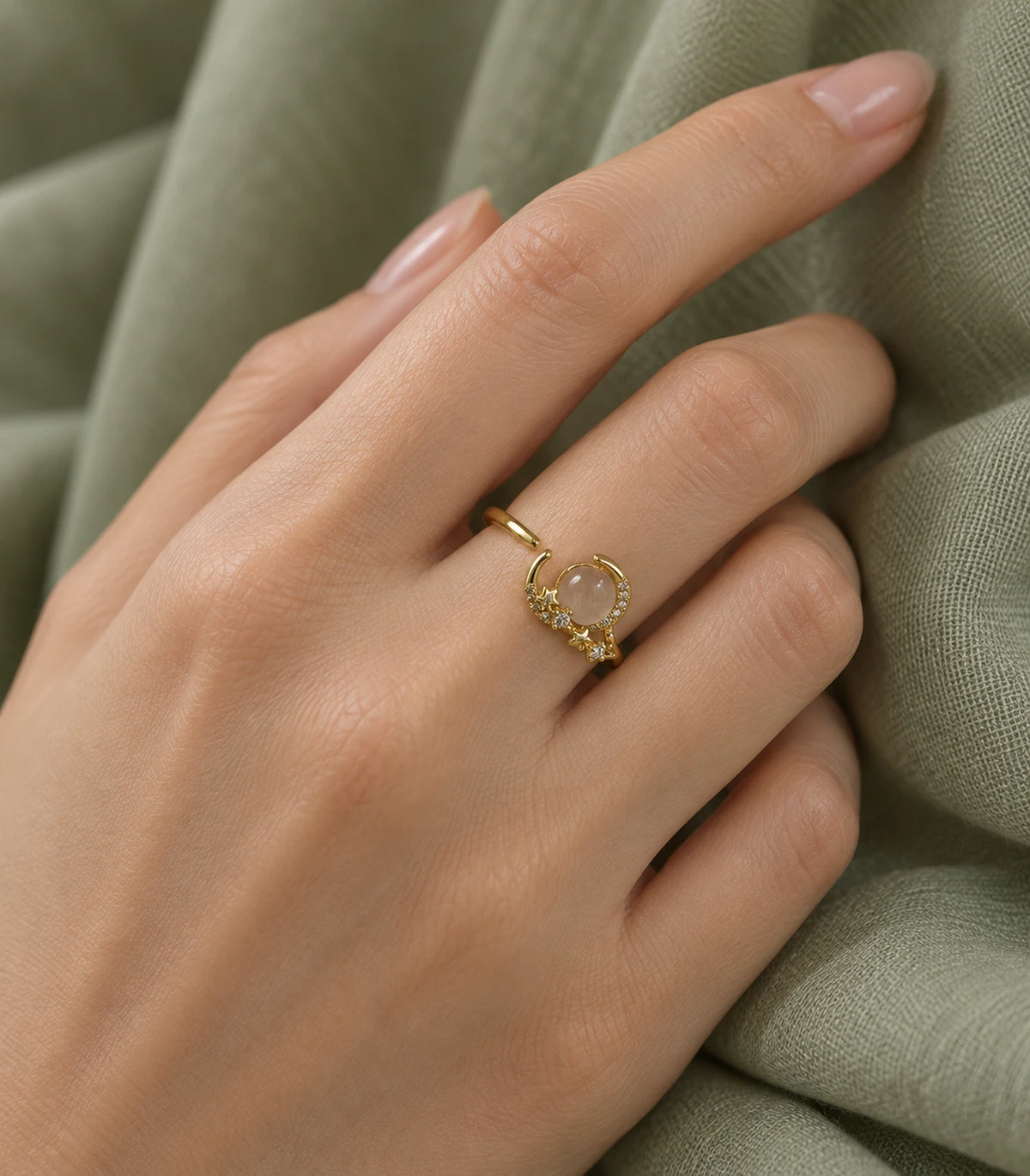 Gold crescent star cabochon open ring — editorial model