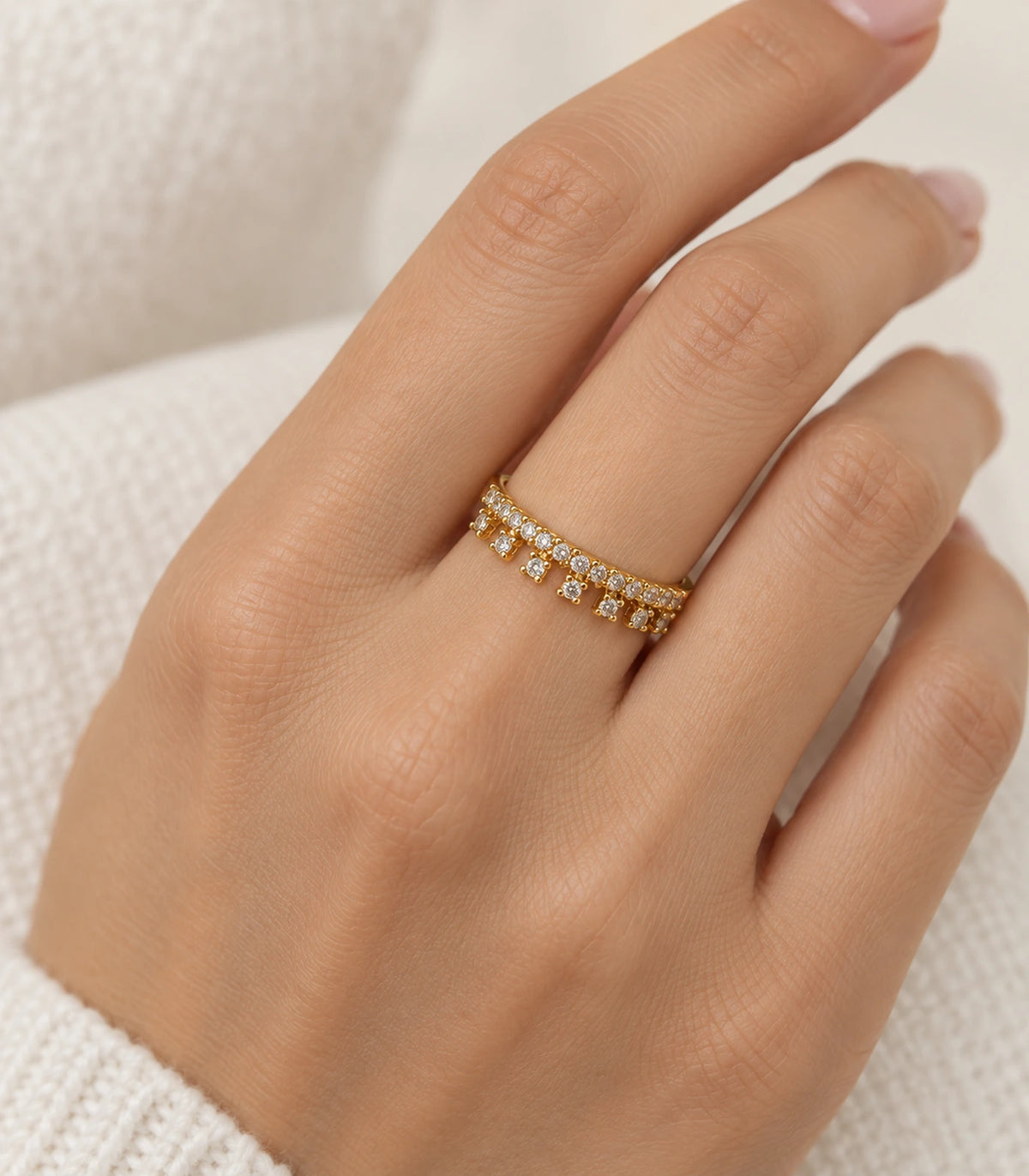 Gold Crystal Fringe Band Ring worn on a finger