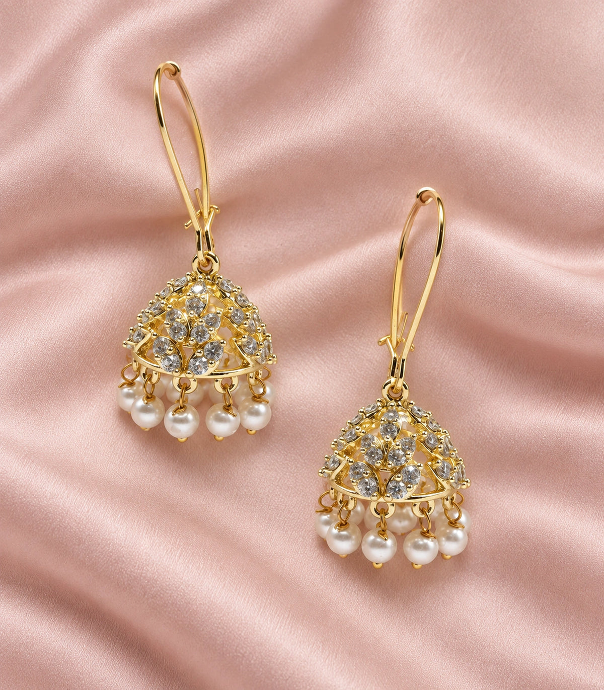 JIMIKI Crystal Leaf Pearl Hoop Jhumka Earrings - Gold pair in a styled flatlay #color_gold