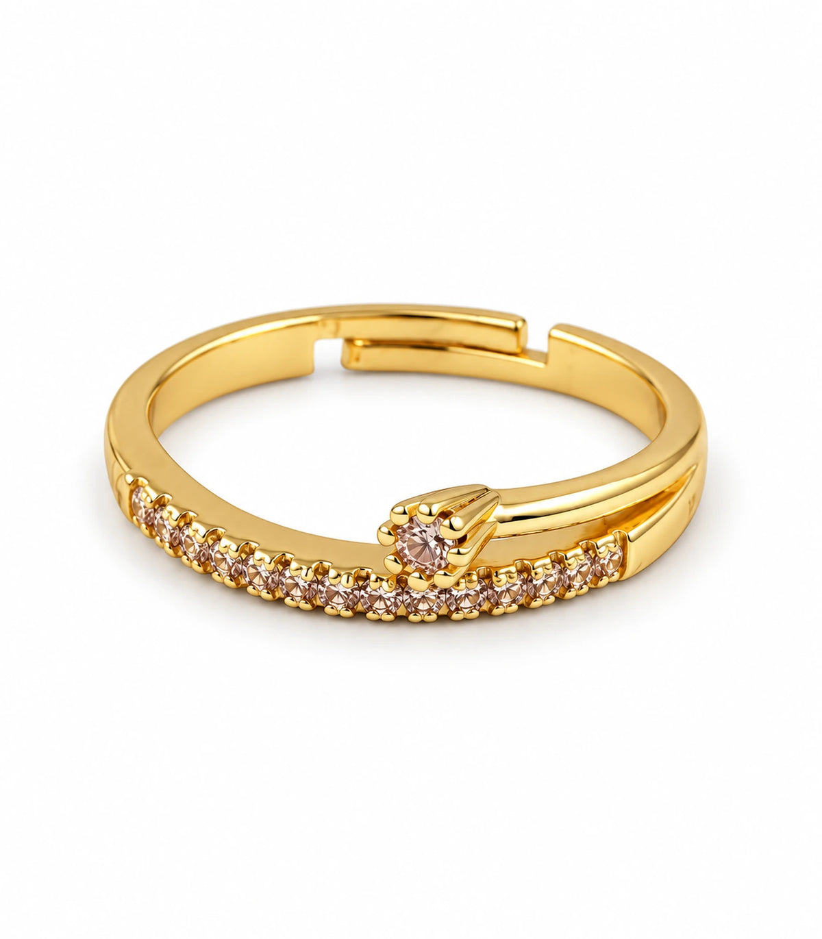 Gold-tone wishbone arrow ring with clear crystal-style row and raised accent on a white background