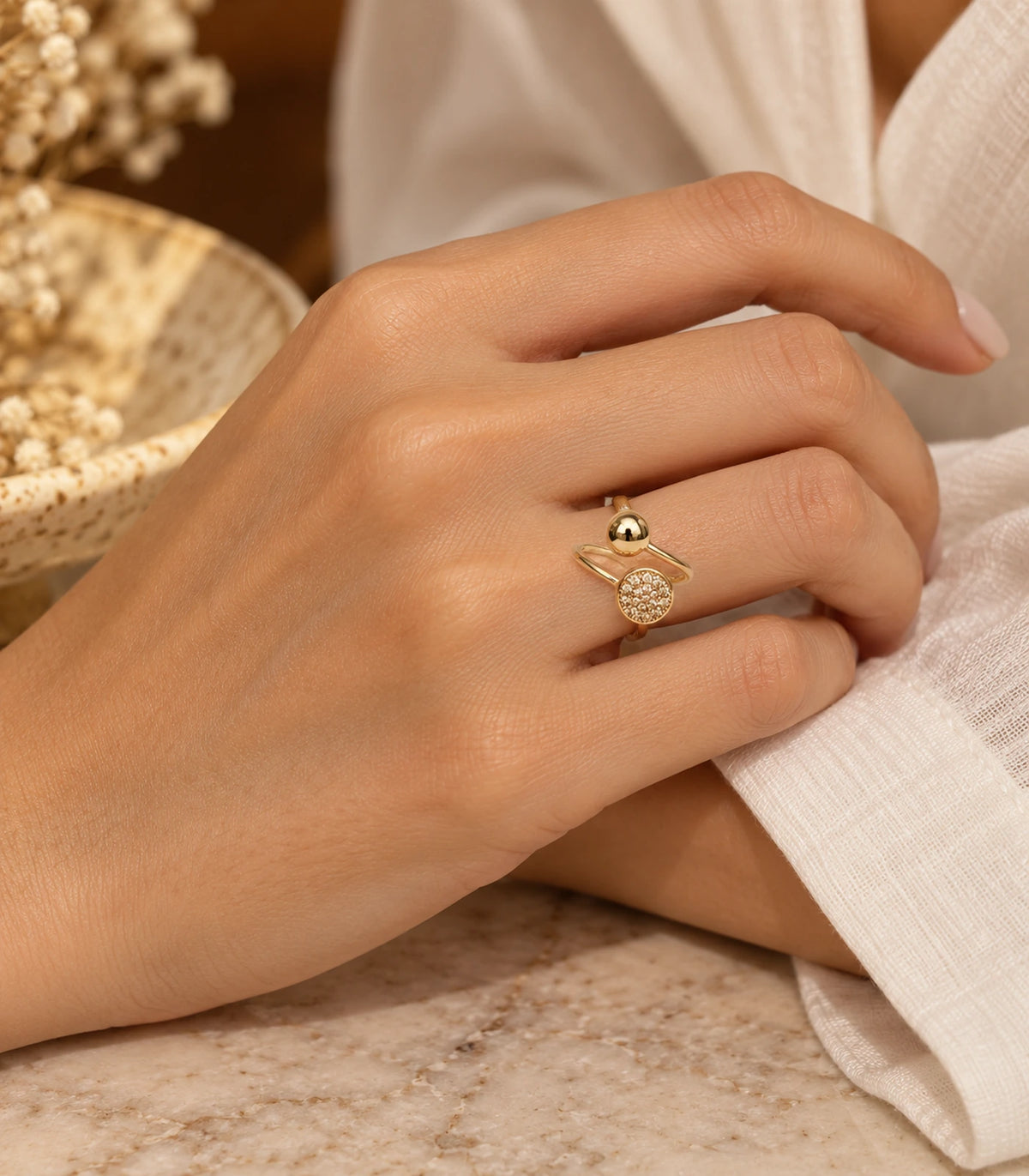Gold Dual Disc Crystal Open Ring worn in an editorial hand pose