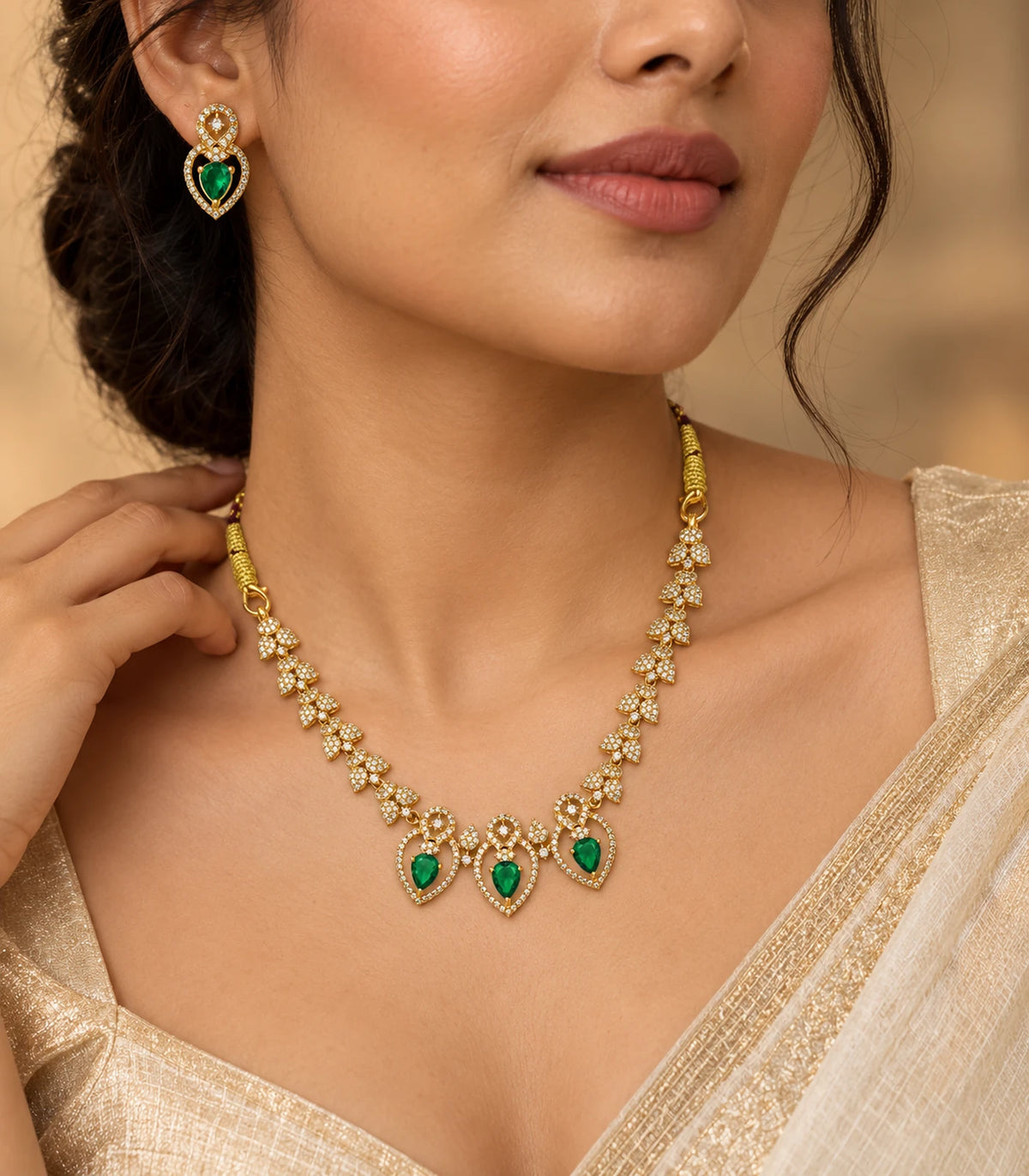 Gold Emerald Heart Crystal Necklace Set worn in an editorial pose