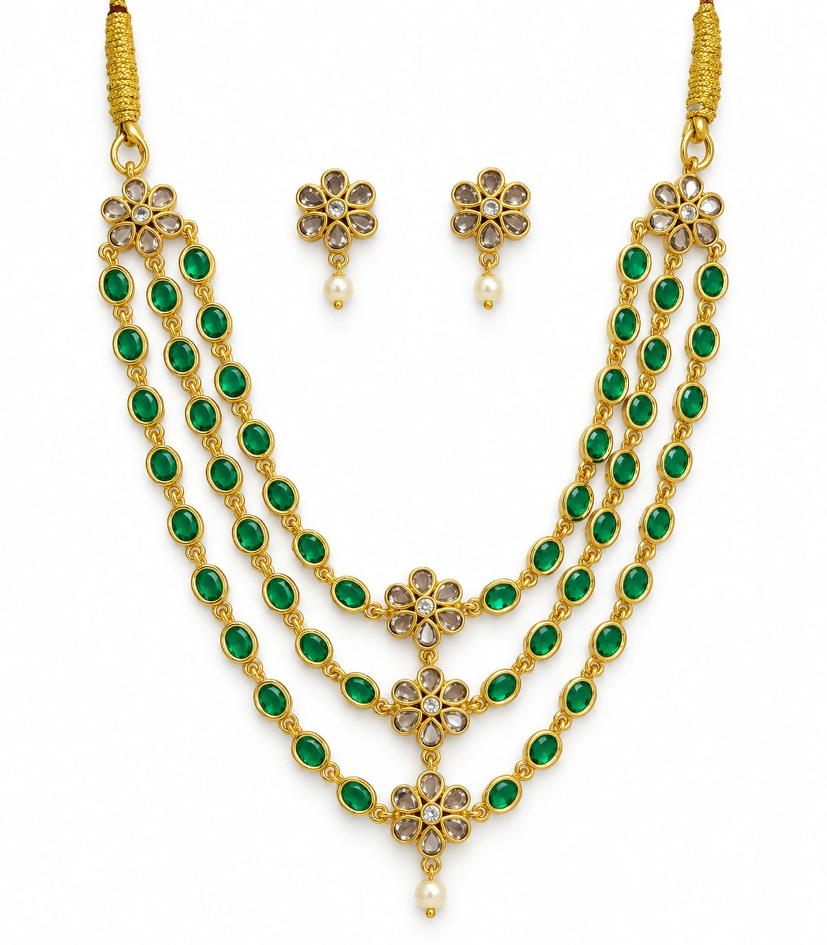 Gold-tone emerald-green triple-strand floral necklace with matching floral white-drop earrings on white