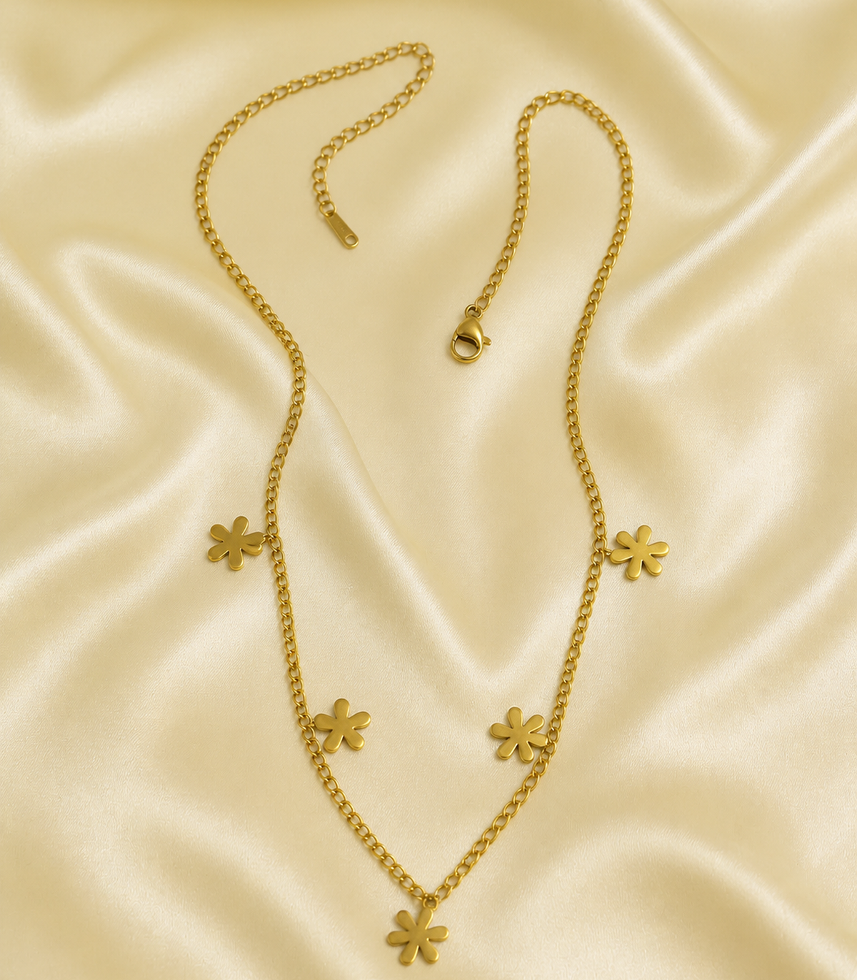 Gold Five Flower Chain Necklace styled in a flat lay