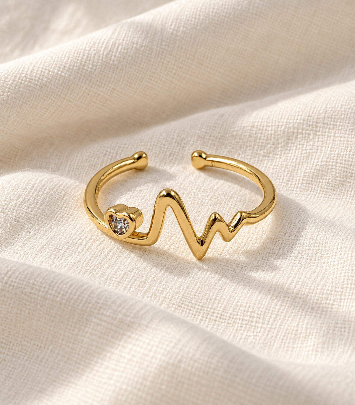 Gold Heart Heartbeat Open Ring — editorial flatlay view