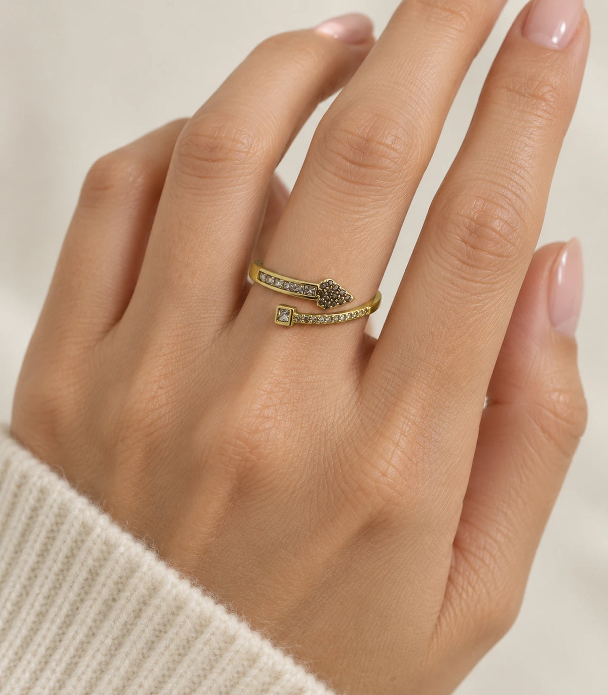 Gold heart and square wrap open ring worn on a finger