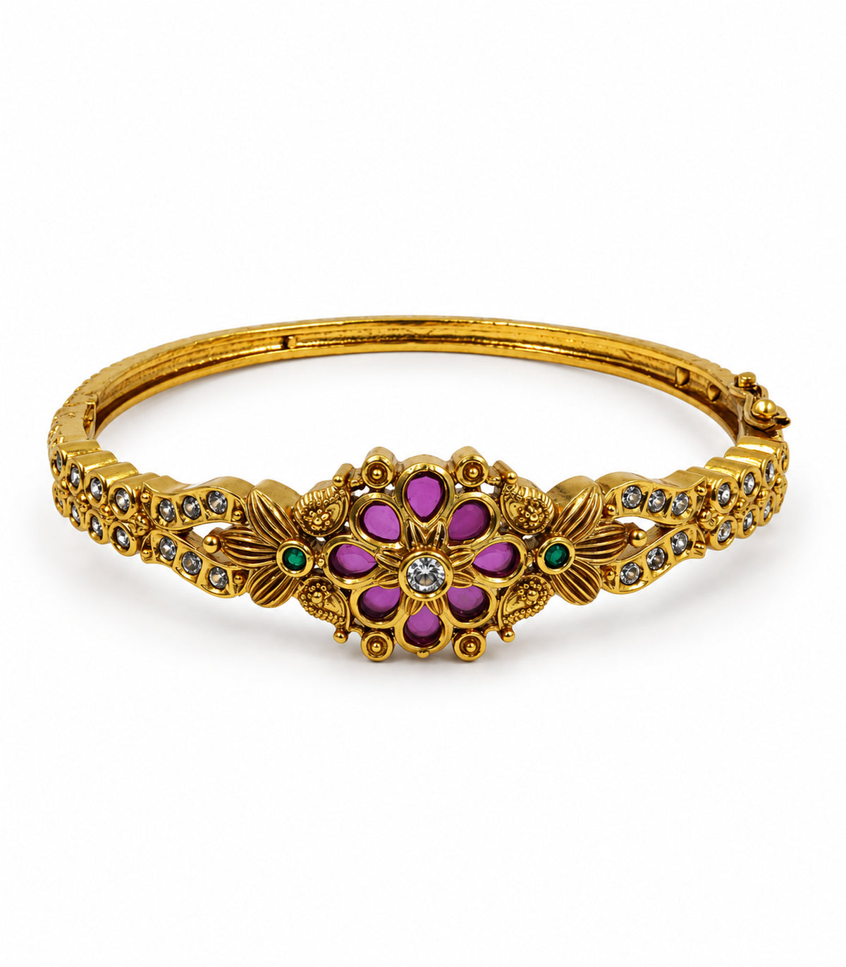 Gold-tone magenta eight-petal and green floral bangle on a white background