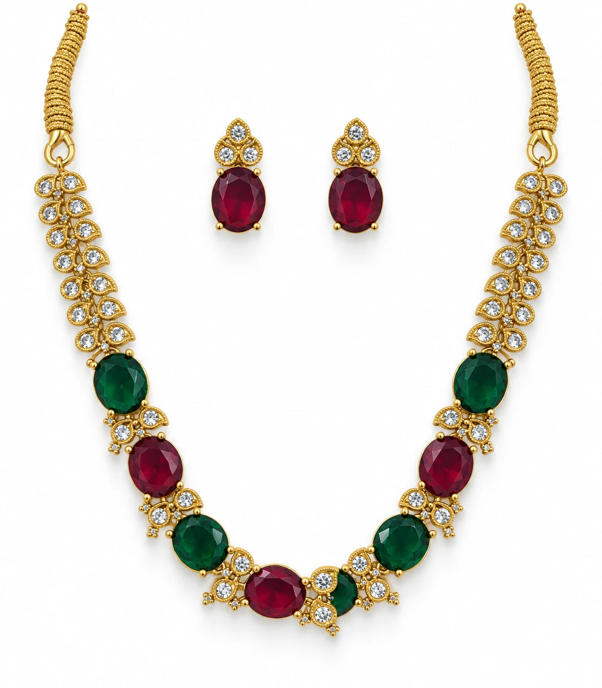 Gold-tone necklace with magenta and green oval accents and two matching earrings on white