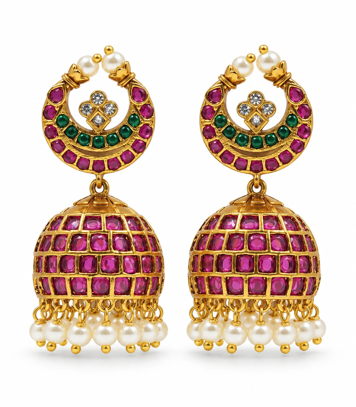 Pair of gold-tone magenta and green circular lattice jhumka earrings with white pearl-like drops on white
