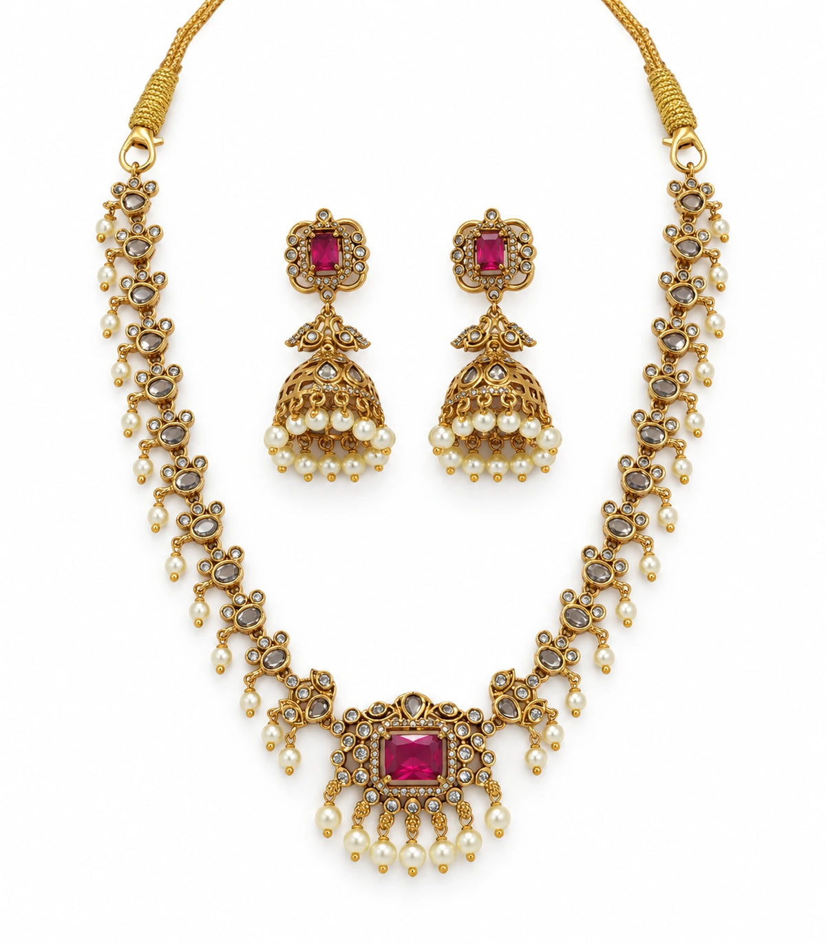 Gold Magenta Kundan necklace and matching jhumka earring pair on white background