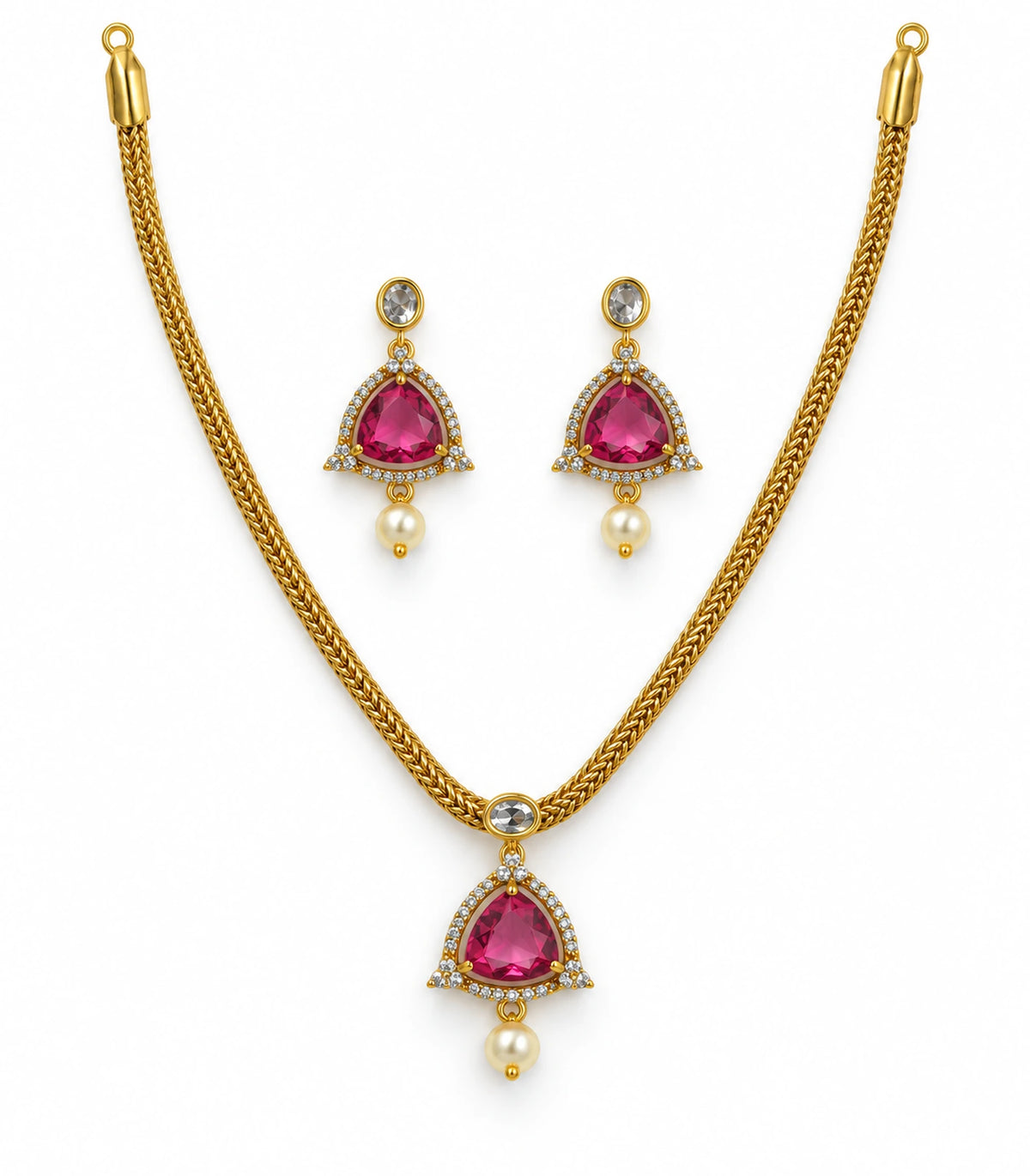 Gold-tone necklace and matching earring pair with magenta centres, clear borders and pearl drops on white
