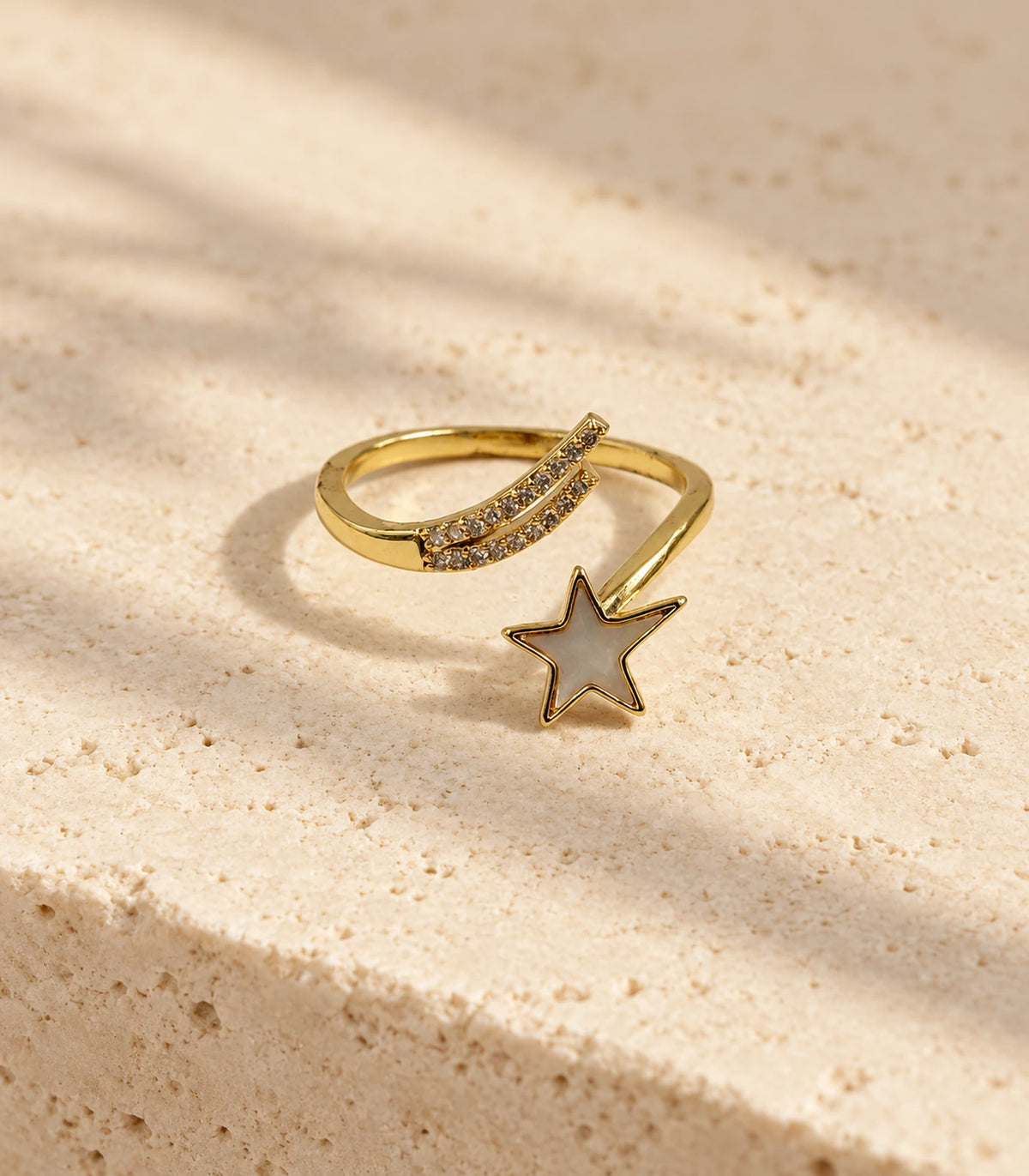 Gold Mother of Pearl Shooting Star Open Ring — editorial flatlay view
