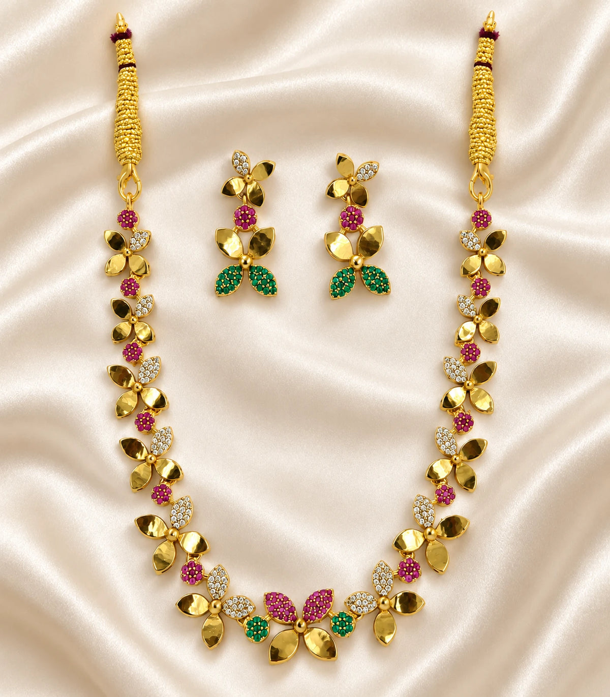 Gold Multicolor Butterfly Crystal Necklace Set, complete necklace and pair of earrings on ivory fabric